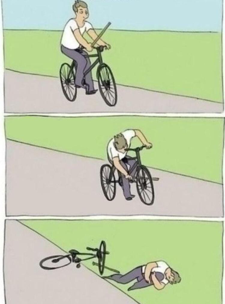 A cyclist puts a stick into his own wheel, then falls off.